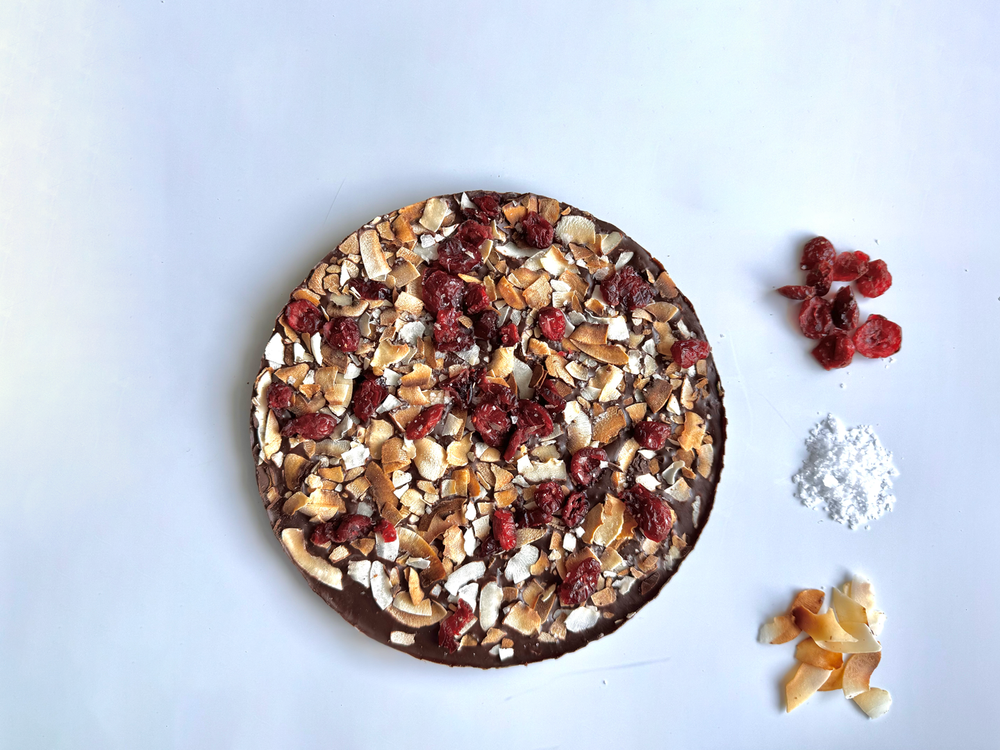 Icelandic handmade chocolate with caramelized coconut, cranberry and sea salt. -topiceland